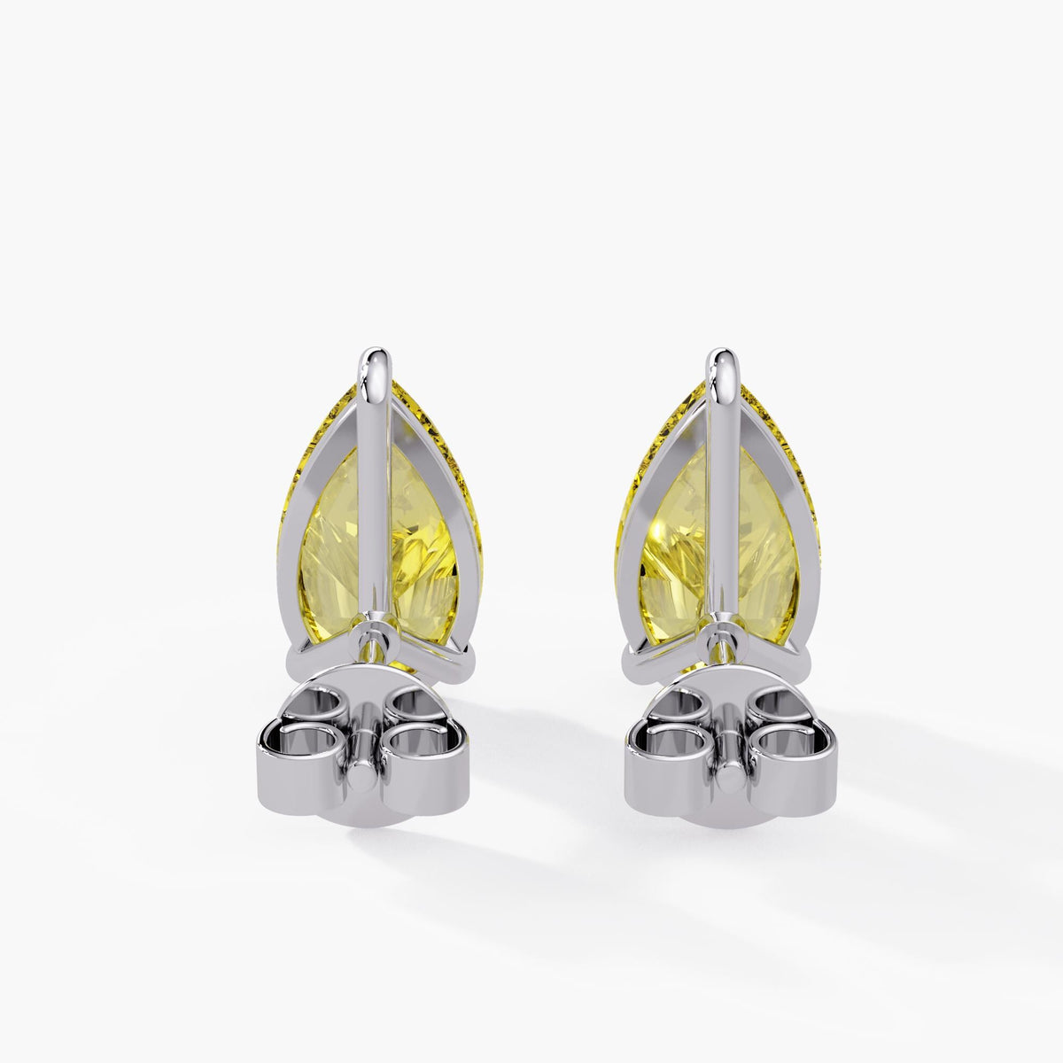 Fancy intense yellow pear diamond earrings in 14K white gold with three prong setting