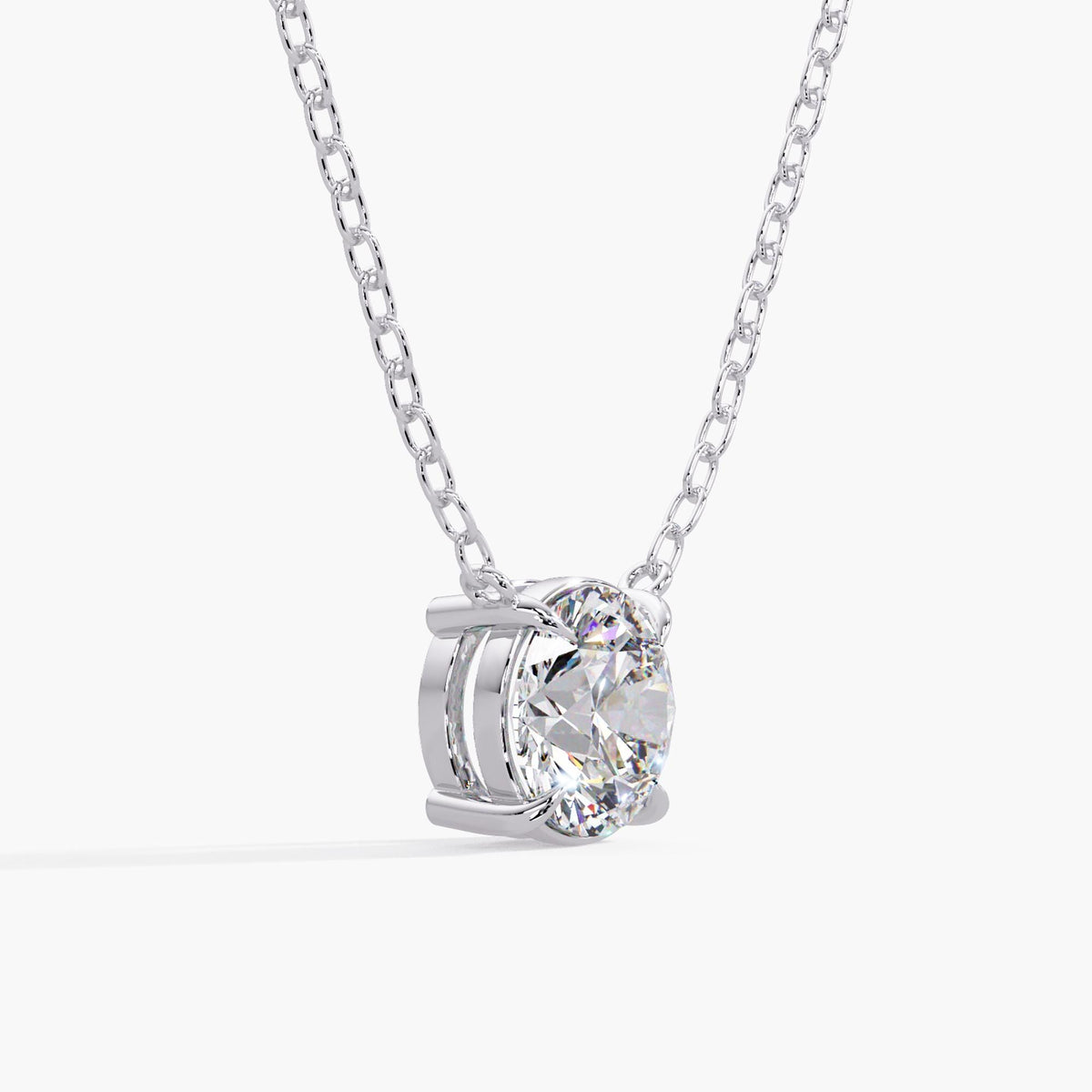 Round lab-grown diamond solitaire pendant necklace in 14K white gold, featuring a four-prong setting and delicate cable chain