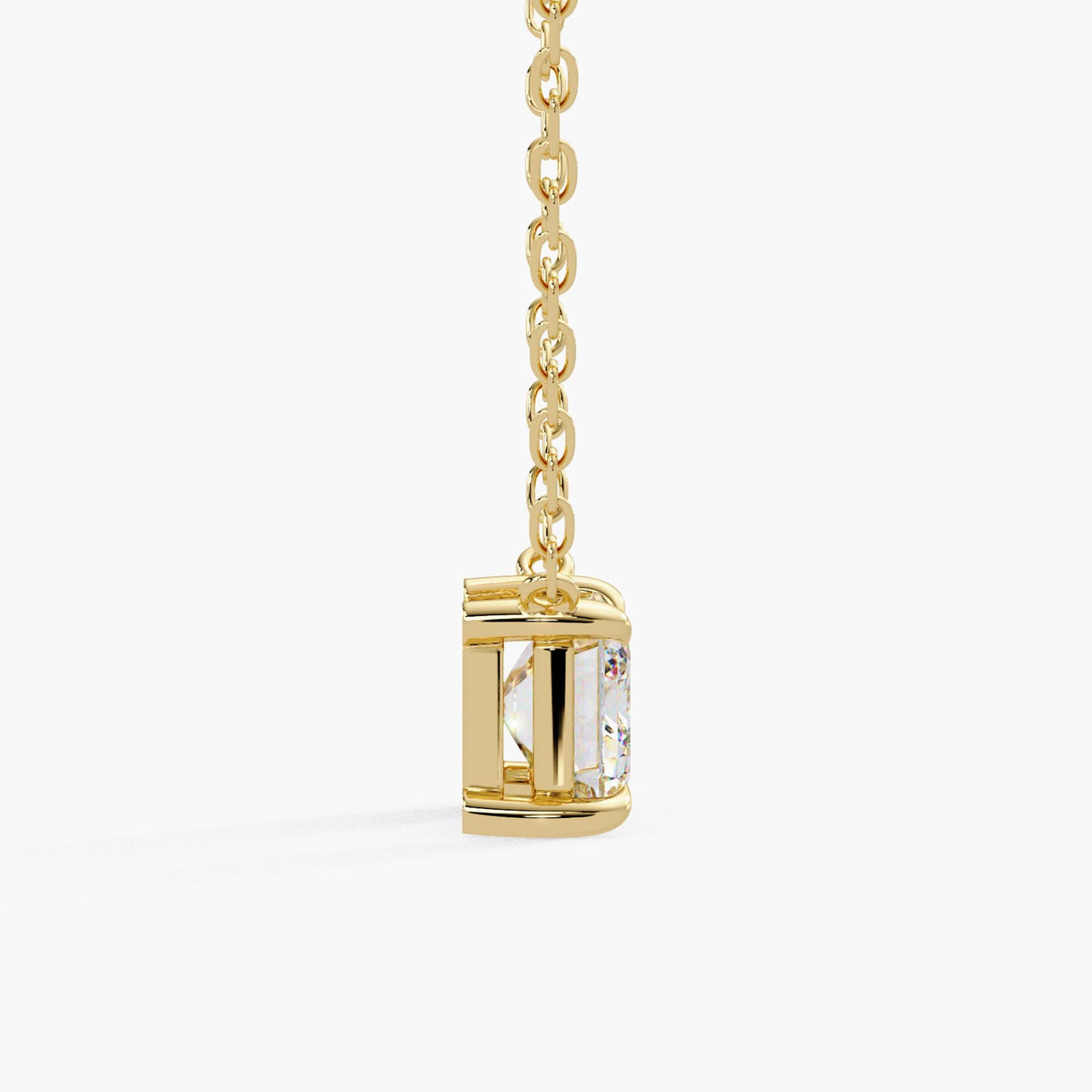 emerald cut solitaire necklace / lab created diamond pendant / 14K yellow gold chain / open basket setting / side profile